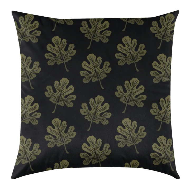 Pillow with leaf pattern on a black background